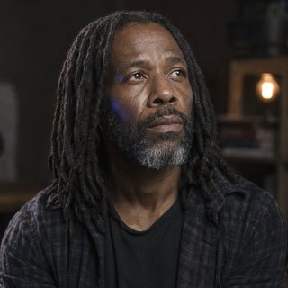 Photoreal portrait of Idris, Legacy Code Archaeologist